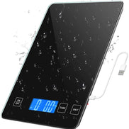 Digital kitchen scale with water droplets on the surface and a USB cable.