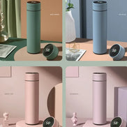 Four different colored thermos bottles with digital displays on a minimalistic background.