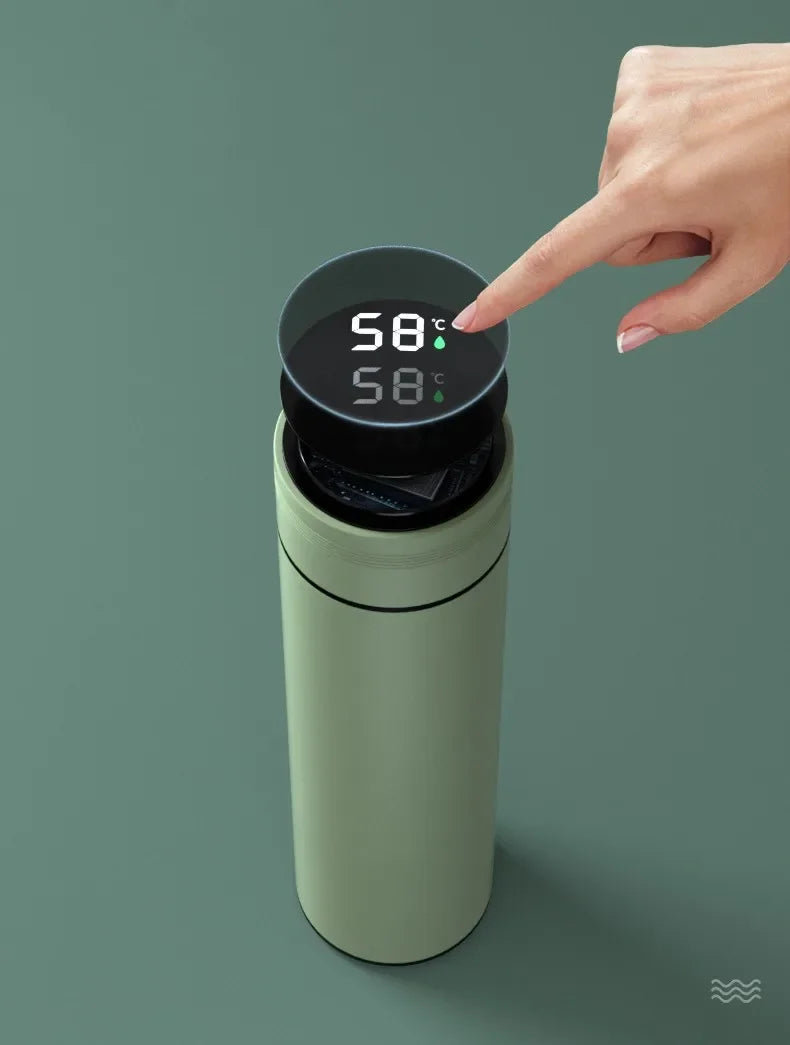 Green thermos with digital temperature display on a green background