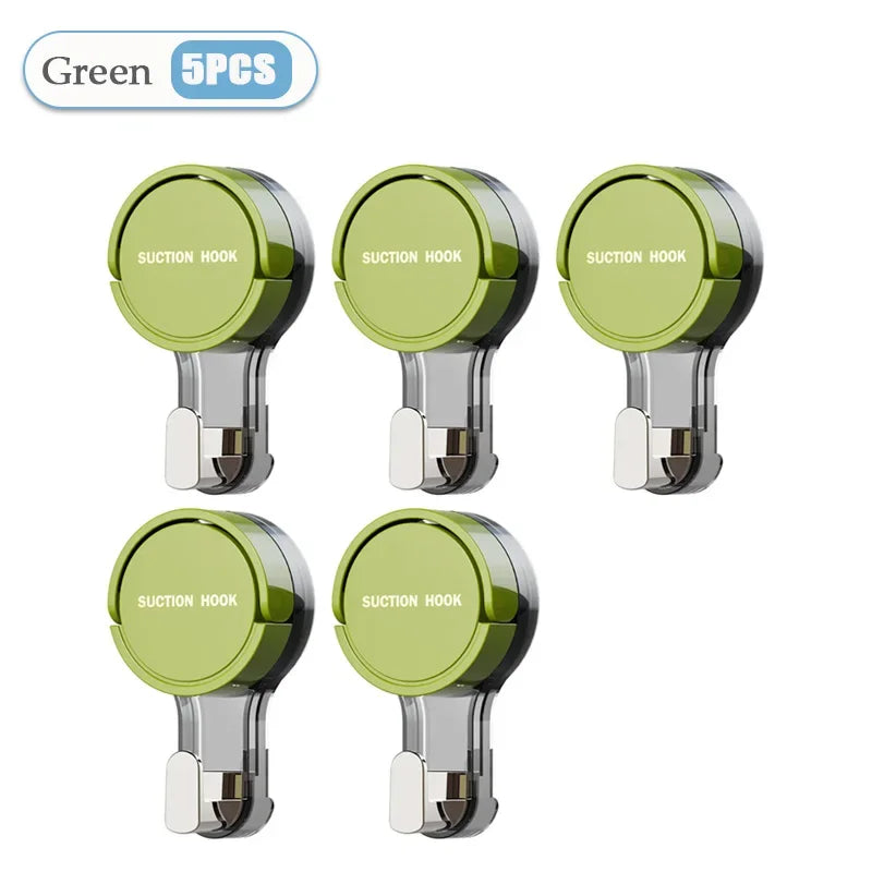 Five green suction hooks on a white background