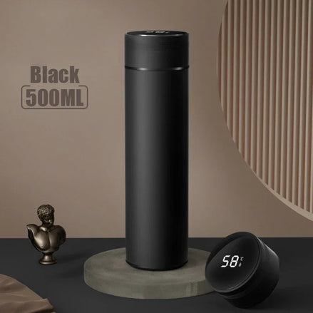 Black 500ML thermos bottle on a gray surface with a digital display showing temperature.