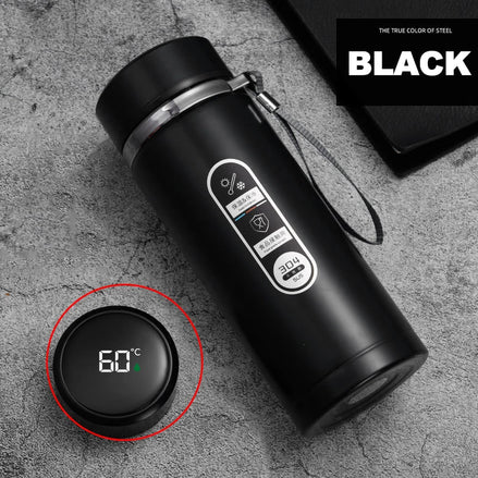 Black thermos bottle with digital temperature display on a gray surface, featuring the brand 'Black'.