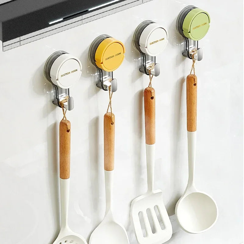 Set of kitchen utensils with wooden handles hanging on a magnetic strip.